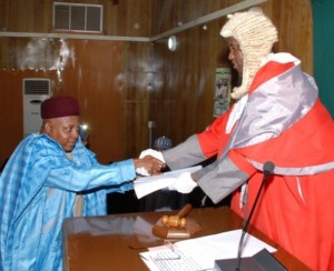 GOVERNOR KASHIM SHETTIMA PRESENTING THE BUDGET PROPOSAL TO THE SPEAKER OF THE STATE HOUSE OF ASSEMBLY, ABDULKARIM LAWAN.
