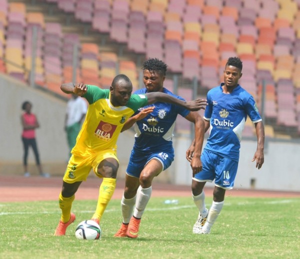Kano Pillars' Isaac Loute Fends Off Dolphins Ifeanyi Egwim's Challenge During the 2015 Super 4 Pre-Season in Abuja. Image: LMC