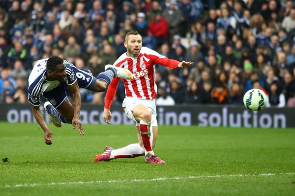 Brown Ideye Scores a Diving Header Against Stoke City in a Premier League Game. Image: Getty.