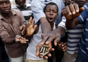 Protesters show bullet casings during a protest against Burundi President Pierre Nkurunziza and his bid for a third term in Bujumbura, Burundi May 19, 2015. REUTERS/Goran Tomasevic
