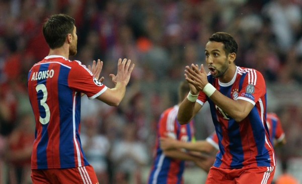 Mehdi Benatia and Xabi Alonso After the Former's Opener against Barca. Image: AFP/ Getty.
