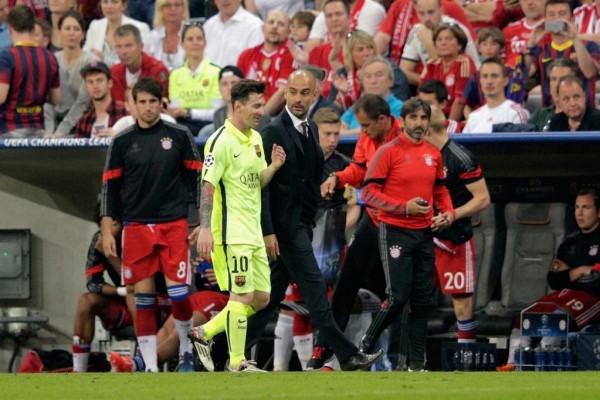 Pep Guardiola and Lionel Messi Chatting on Their Way Back to the Dressing Room at the Allianz Arena. Image: AFP/Getty.