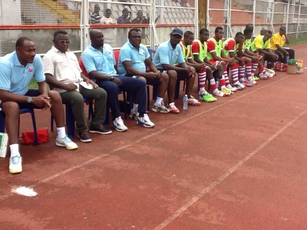 Coach Erasmus Onuh (2nd from Right) Watches On During a Glo Premier League Game. Image: Twitter @HeartlandFC_ng.