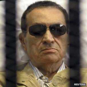 A DEFIANT HOSNI MUBARAK BEHIND BARS. SUFFERED CRACKED RIBS & FLUID IN LUNGS
