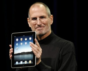 Steve Jobs holding an Ipad