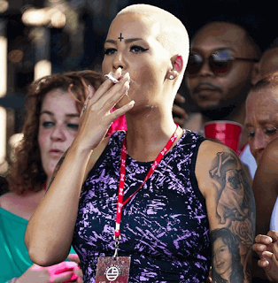 PHOTO Amber Rose gets a tattoo of Wiz Khalifas face on her arm