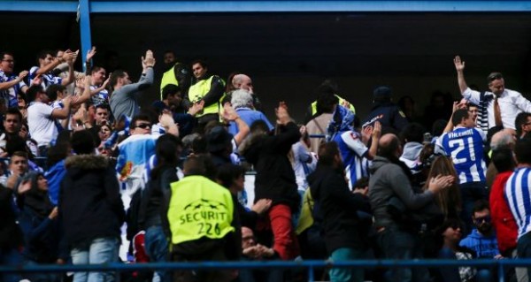 Deportivo Supporters Were Escorted Out of the Vicente Calderon Stadium By Security Personnel Following Rival Fans Clash in Madrid Rio. Image: AFP/Getty. 