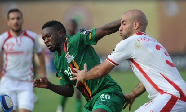 Emmanuel Mayuka of Zambia battles with Aymen Abdennour of Tunisia . Image: Caf via Getty. 