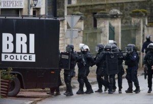 French special intervention police conduct a house-to-house search in Longpont, northeast of Paris
