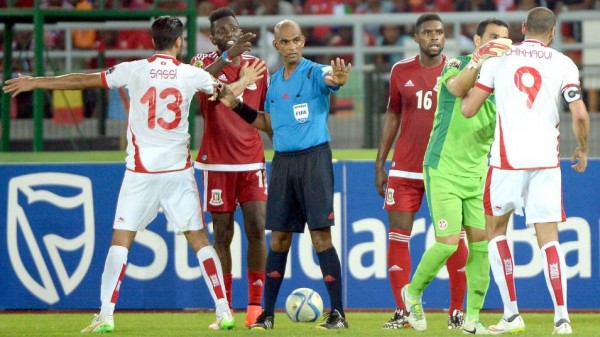 Tunisian Players Confronted Refree Seechurn Rajindrapasard Following their 2-1 Elimination fromAfcon 2015 at the Hands of Equatorial Guinea. Image: AFP.