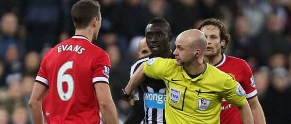 Jonny Evans and Papiss Cisse Clash in the First Half of Newcastle's 1-0 Home Defeat By Manchester United. Image: Getty.