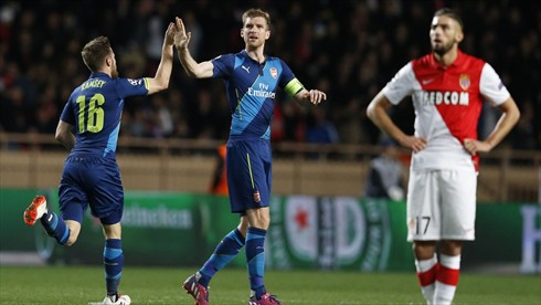Per Mertesacker and Aaron Ramsey after the Welshman's Goal at Monaco. Image: AFP/Getty.
