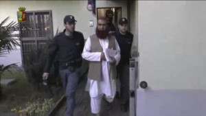 Still image from video shows Italian Policemen detaining a man suspected to be member of armed organisation inspired by al Qaeda in this still image taken from a video released by Italian Police