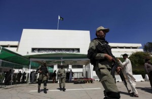 Paramilitary soldiers walk past the Parliament building during a joint sitting of the parliament in Islamabad
