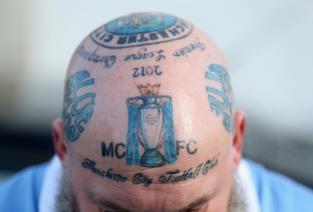 Check Out Top 10 Craziest Football Fans And Their Tattoos - Information Nigeria
