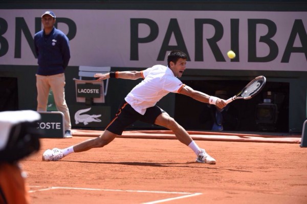 Novak Djokovic Scampers to Return Play against Richard Gasquet. Image: RG via Getty.