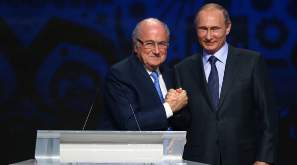 FIFA's President Sepp Blatter shakes hands with Russia's President Vladimir Putin (R) during the preliminary draw for the 2018 FIFA World Cup at Konstantin Palace in St. Petersburg, Russia July 25, 2015. REUTERS/Stringer