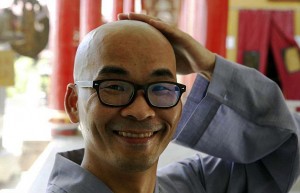 Pic shows: Liu Jingchong. A millionaire who began living in the isolated mountains in north-west China two years ago has fulfilled his dream of becoming a Buddhist monk after giving up all of lifes material pleasures to pursue a lifestyle driven by spiritual enlightenment. Liu Jingchong, a businessman born in Chinas southern Guangdong Province, was recently accepted as a monk at Baochan Temple in the county of Hanshan, in east Chinas Anhui Province, after spending two years living in isolation. The 39-year-old swapped big city life as well as millions in annual income to live a minimalistic life on Zhongnan Mountain in northwestern Shaanxi Province after an epiphany came to him one day, causing him to realise that people will never stop pursuing bigger houses, better jobs, and more expensive cars if they continue to live in metropolises, failing to focus on their "inner" life. He then dropped everything and left for the mountains in December 2012, where he spent most of his days meditating, reading, and practising calligraphy. Living in a shed made of straw became his norm, and Jingchong soon found new meaning in isolation and silence. Jingchong said of his time in the mountains: "The living conditions were bad. My bed was made of bricks and there was no electricity during the snowy winter." He continued: "But I didnt feel cold there. Maybe it was because I liked the life there and focused just on what I liked." Jingchong grew his own vegetables in the mountains and only left his hermit lifestyle to buy rice, flour, and oil. He said he spent almost no money during the two years, and also did not need a watch, as he rose with the sun and slept with the moon. After meeting an eminent monk from Baochan Temple, who became his master, Jingchong travelled to Anhui Province to take a tonsure  the shaving of a Buddhist monks head  and began living with others like him who prefer a quieter, simpler life. Jingchong has been at the temple for three months now and instead of managing millions networks as a cook in the communal kitchen. (ends)