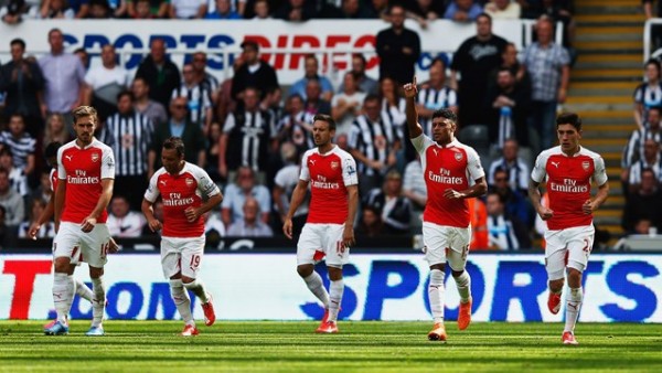 Alex Oxlade-Chamberlain Celebrates With Team-Mates after Watching Fabricio Coloccinin Deflect His Shot for Arsenal Goal at Newcastle. Image: Getty.