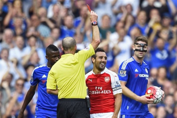 Santi Cazorla Receives His Second Yellow Card for a Foul on Cesc Fabregas. Image: Getty.