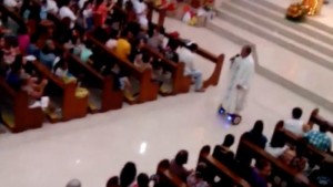 this-priest-has-been-suspended-for-riding-a-hoverboard-during-christmas-mass-1451482525