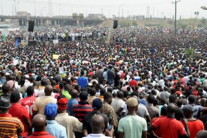 Leadership of labour and civil society speaks to thousands of people protesting against the scrapping of oil subsidy at Gani Fawehinmi Park in Lagos, on January 11, 2012. Thousands of protesters gathered at the Gani Fawehinmi Park in the third day of on-going mass strike by labour and civil society to protest the scrapping of oil subsidy by the government. AFP PHOTO/PIUS UTOMI EKPEI (Photo credit should read PIUS UTOMI EKPEI/AFP/Getty Images)