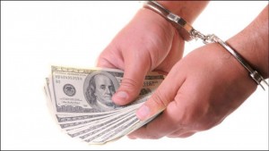 09252012_money_handcuffs_article