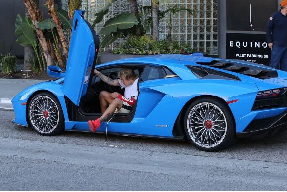 Justin Bieber shows off his Lamborghini Aventador and Kanye West's $9,000  Nike Air Yeezy Sneakers in LA (Photos) - Information Nigeria