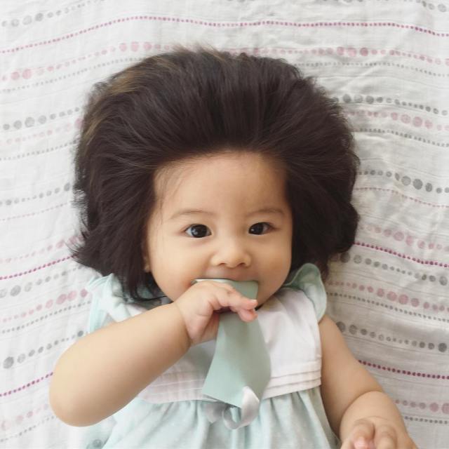 Six-months-old baby breaks the internet with her incredible hair (Photos) -  Information Nigeria