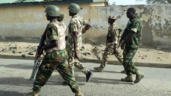 Foreigner orders soldiers In Lagos to beat young lady