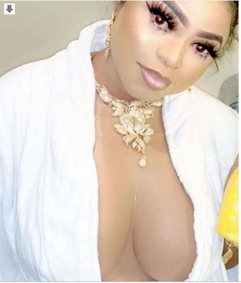 [Photo]: Bobrisky flaunts massive boobs in plunging top