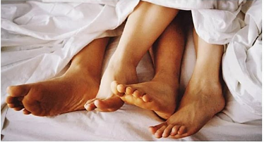 File photo of a man and a woman in bed