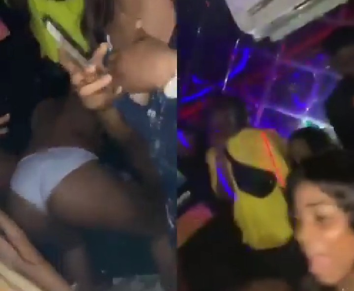 Naira Marley and his friends at a strip club