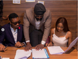 BBNaija Ike while signing the new deal