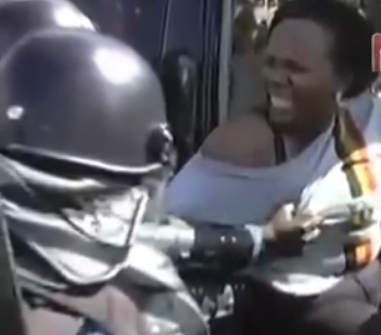 The police officer while harrasing, fondling the woman's breast while trying to arrest her
