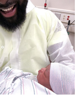 Yomi Casual and the newborn baby