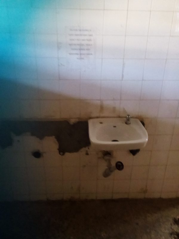 A washing basin inside a toilet on the third floor of Ogun State Ministry of Environment. Photo credit: Gbenga Odunsi/Information Nigeria