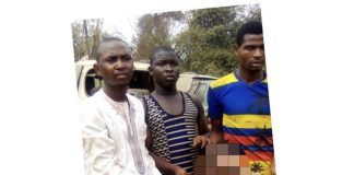 The suspect and his friends holding the human head