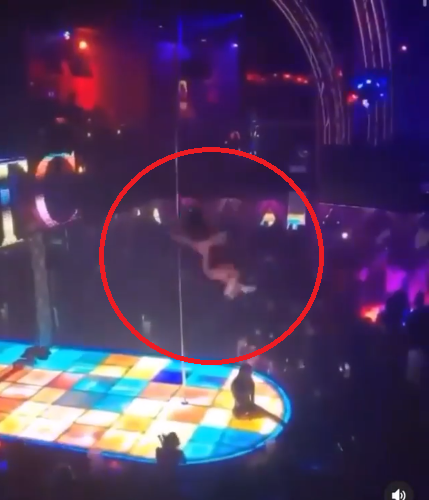 The stripper while falling from the pole