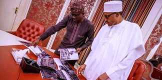 Photo of Sanwo-Olu showing president Buhari photos of Lagos explosion