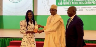 Tobi Amusan receiving award from Buhari